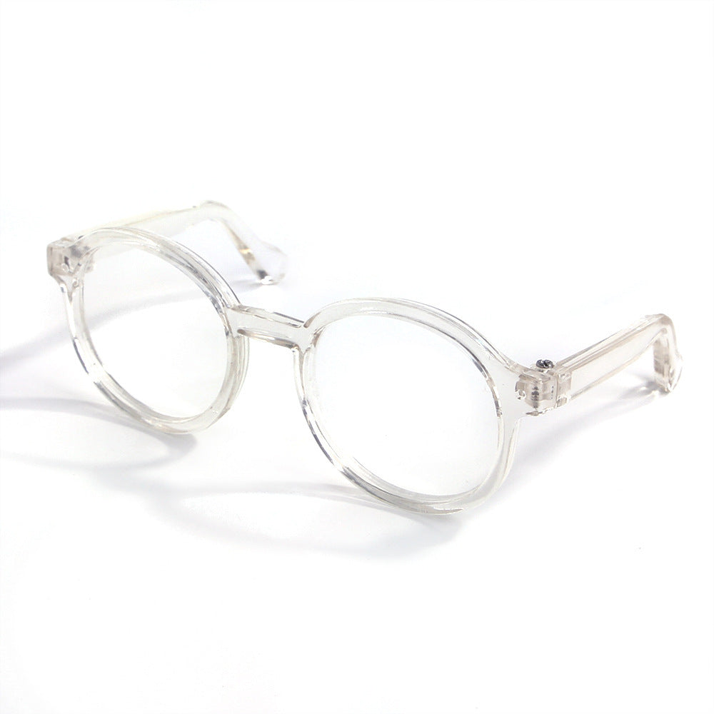 Clear transparent round plastic cat glasses on white background
