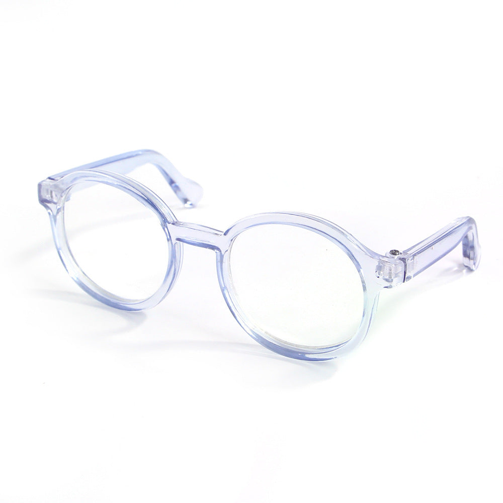 Sky blue transparent round plastic cat glasses on white background