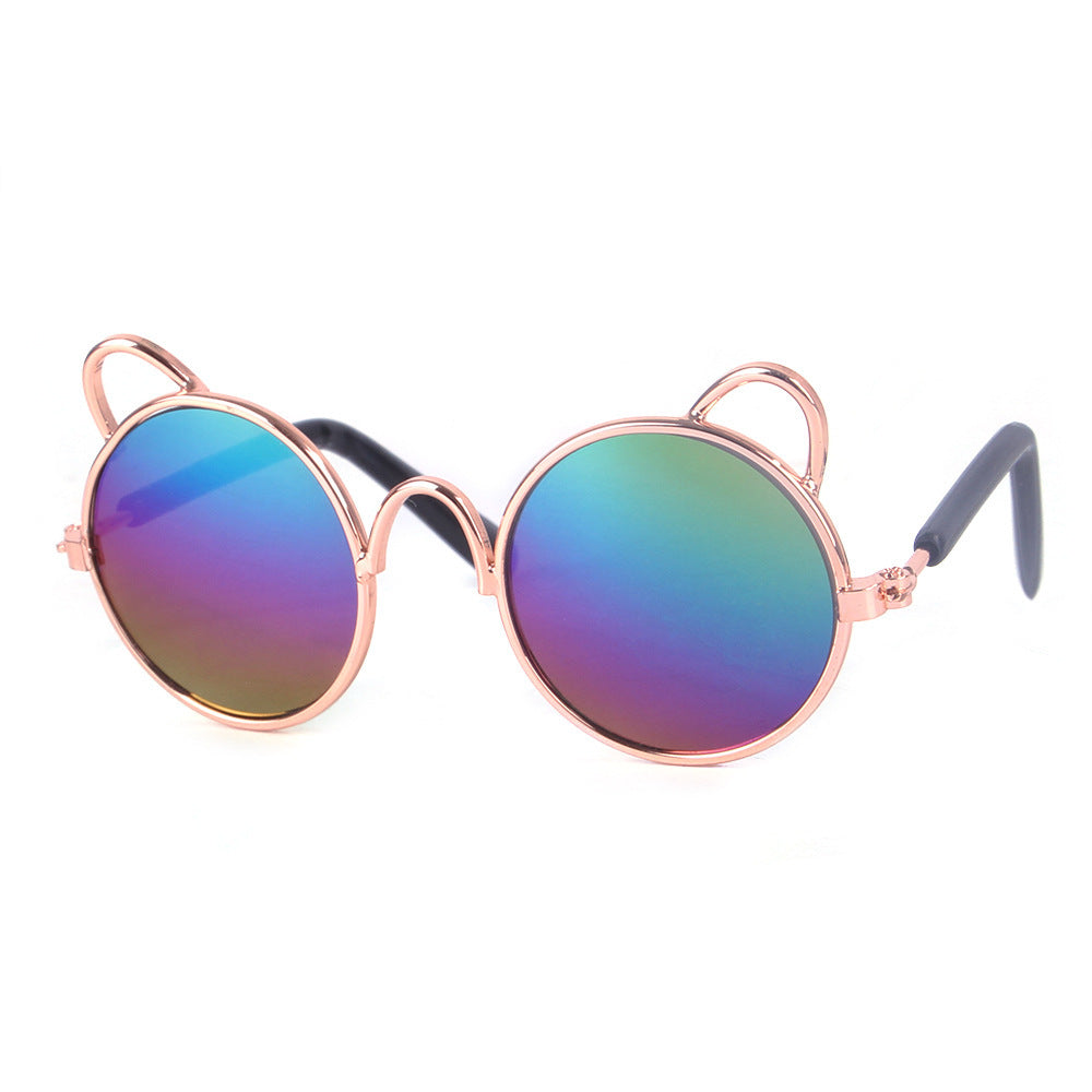 Cat ear round sunglasses with rainbow mirrored lenses and rose gold frame on white background
