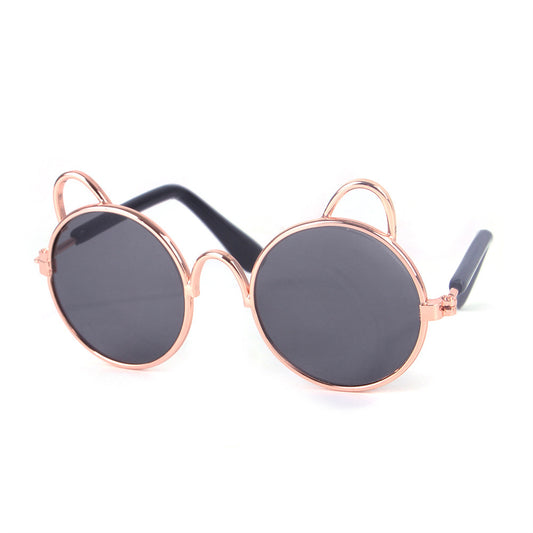 Cat ear round sunglasses with black dark lenses and rose gold metal frame