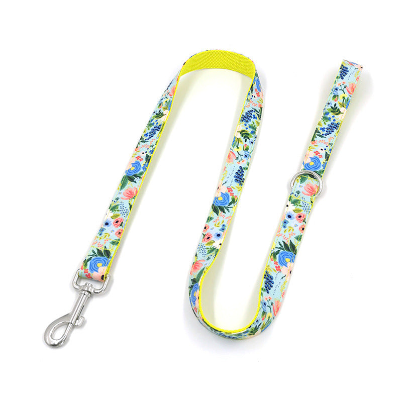 Fully extended floral dog leash laid flat showing colorful floral pattern and metal clasp