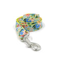 Load image into Gallery viewer, Rolled floral dog leash showing vibrant flower pattern and metal snap

