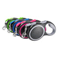 Cargar la imagen en la vista de la galería, Four automatic retractable pet leashes lined up with green, blue, pink, and gray accents

