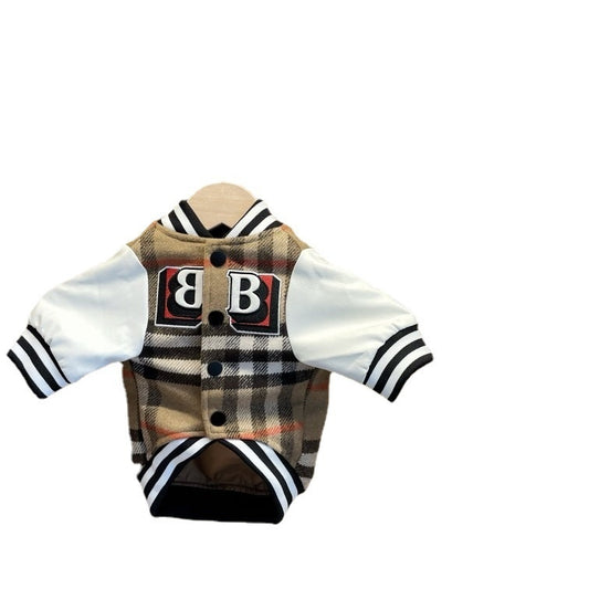 Plaid letter patch dog jacket with white sleeves laid flat showing snap button closures and black and white striped ribbing