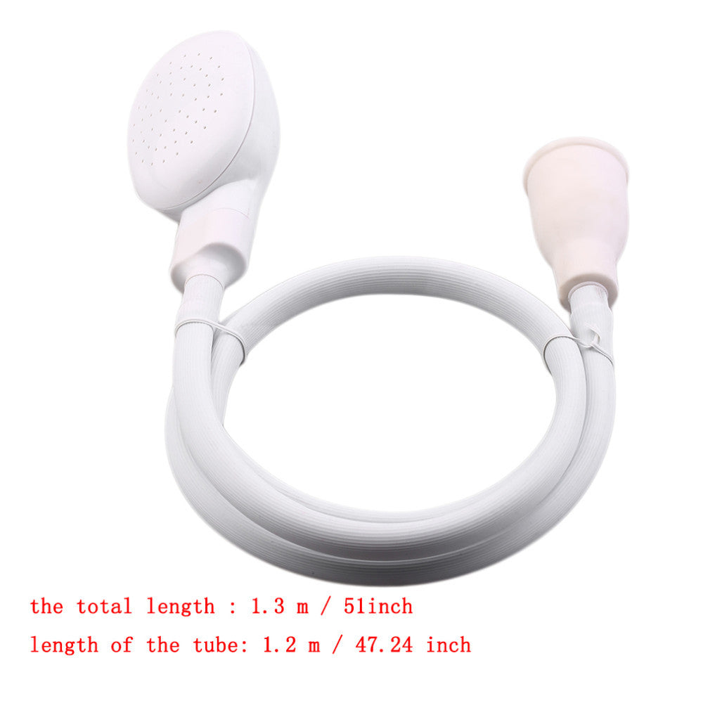 Coiled white shower hose with faucet connector and shower head
