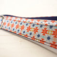 Load image into Gallery viewer, Detailed view of double-stitched patterned polyester leash material
