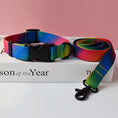 Load image into Gallery viewer, Rainbow gradient colored nylon dog collar and leash with black buckle and clasp on white box
