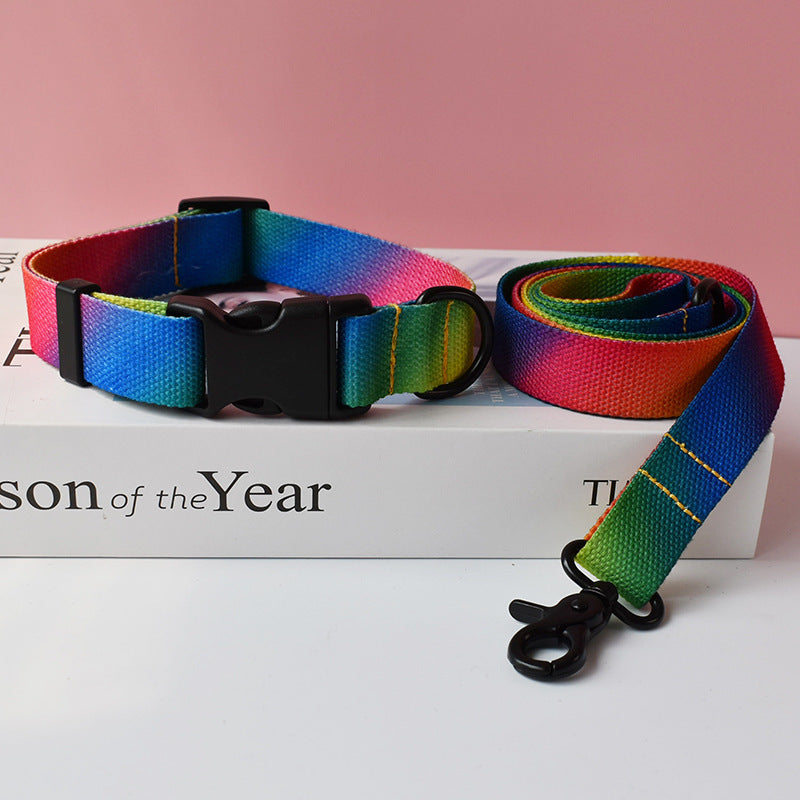 Rainbow gradient colored nylon dog collar and leash with black buckle and clasp on white box