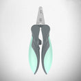 Load image into Gallery viewer, Closed green and gray pet nail clipper viewed from above on gray background
