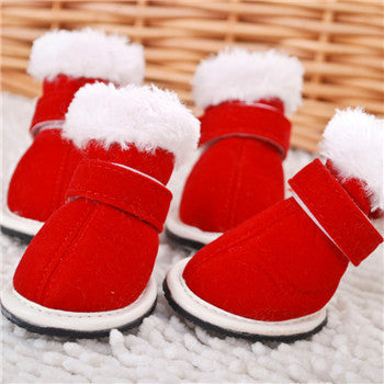 Side view of red pet boots showing adjustable straps and plush lining