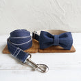 Load image into Gallery viewer, Denim dog collar with matching bow tie and leash displayed on wooden surface
