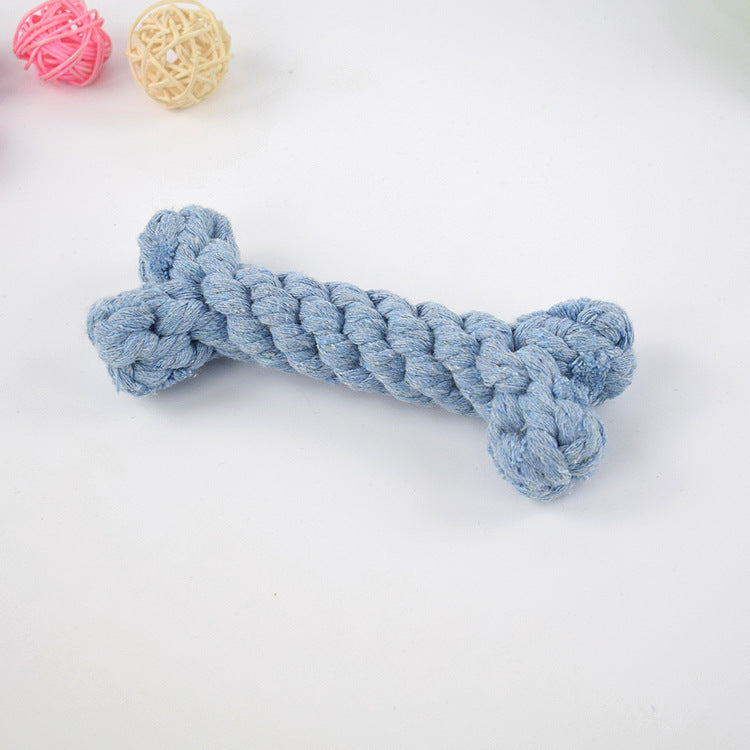 Close-up of blue braided cotton rope dog chew toy bone shape on white background