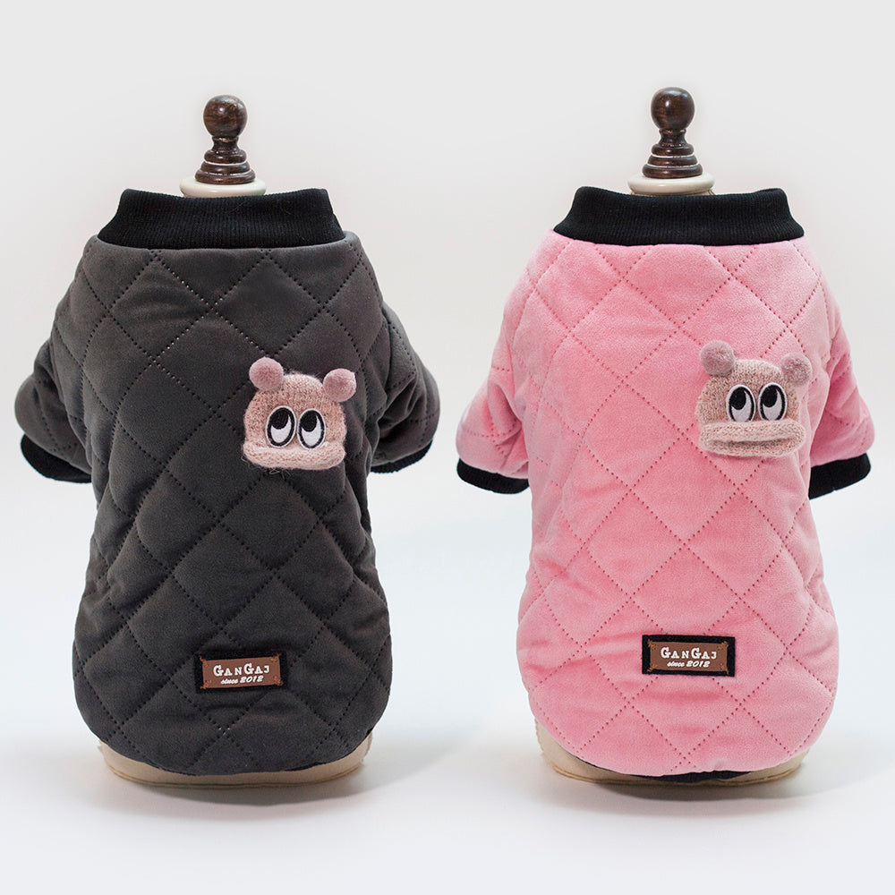 Charcoal gray and soft pink quilted dog jackets displayed on mannequins showing front and back views with black knit collars
