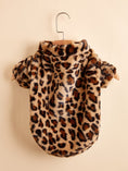 Load image into Gallery viewer, Back view of plush leopard print dog jacket on a wooden hanger showing full pattern and collar
