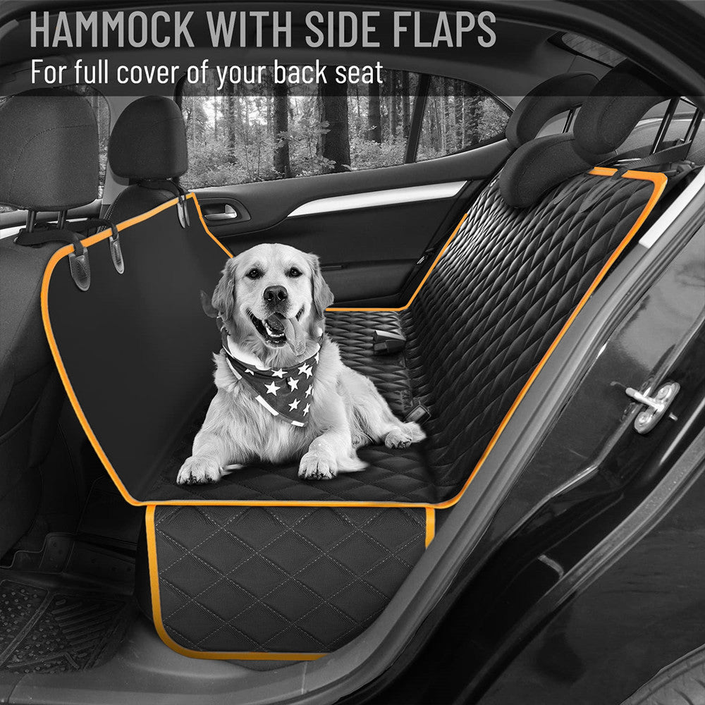 Black dog car seat cover hammock with orange trim installed in back seat, showing full side flap coverage and dog resting