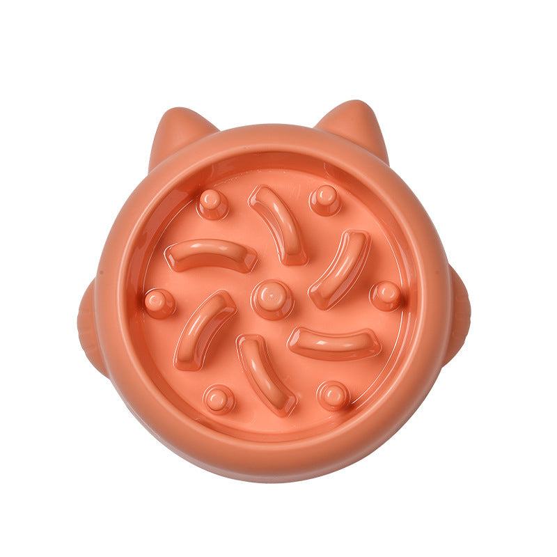 Top view of orange slow feeder bowl featuring bone and knob pattern