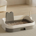 Cargar la imagen en la vista de la galería, Beige and gray dog potty tray from side angle with metal grate resting on top
