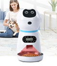 Load image into Gallery viewer, Automatic pet feeder in a bright living room with woman and dog sitting on floor
