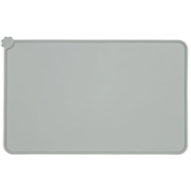 Flexible gray silicone feeding mat bending to highlight material softness  