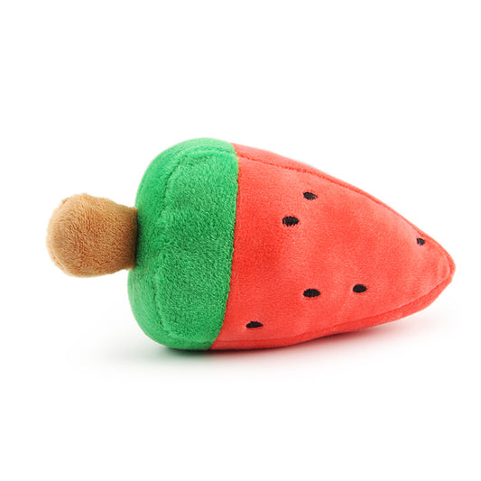 Close-up of the watermelon plush toy showing red body with black seed details and green base with brown stick