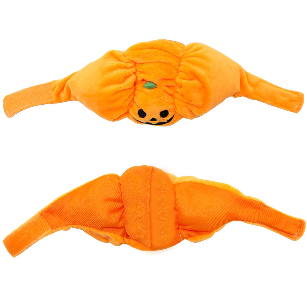 Front and back view of the orange plush pumpkin pet hat showing adjustable Velcro straps