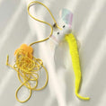 Cargar la imagen en la vista de la galería, Yellow fuzzy fish-shaped cat toy with translucent fins attached to yellow elastic cord on white background
