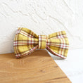 Load image into Gallery viewer, Close-up of yellow plaid bowknot accessory on a wooden surface
