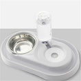 Cargar la imagen en la vista de la galería, White automatic pet feeding station with stainless steel bowl and water dispenser on light gray background
