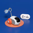 Load image into Gallery viewer, Remote control cat toy with orange wheels and feather on orange display base alongside white remote control on blue background

