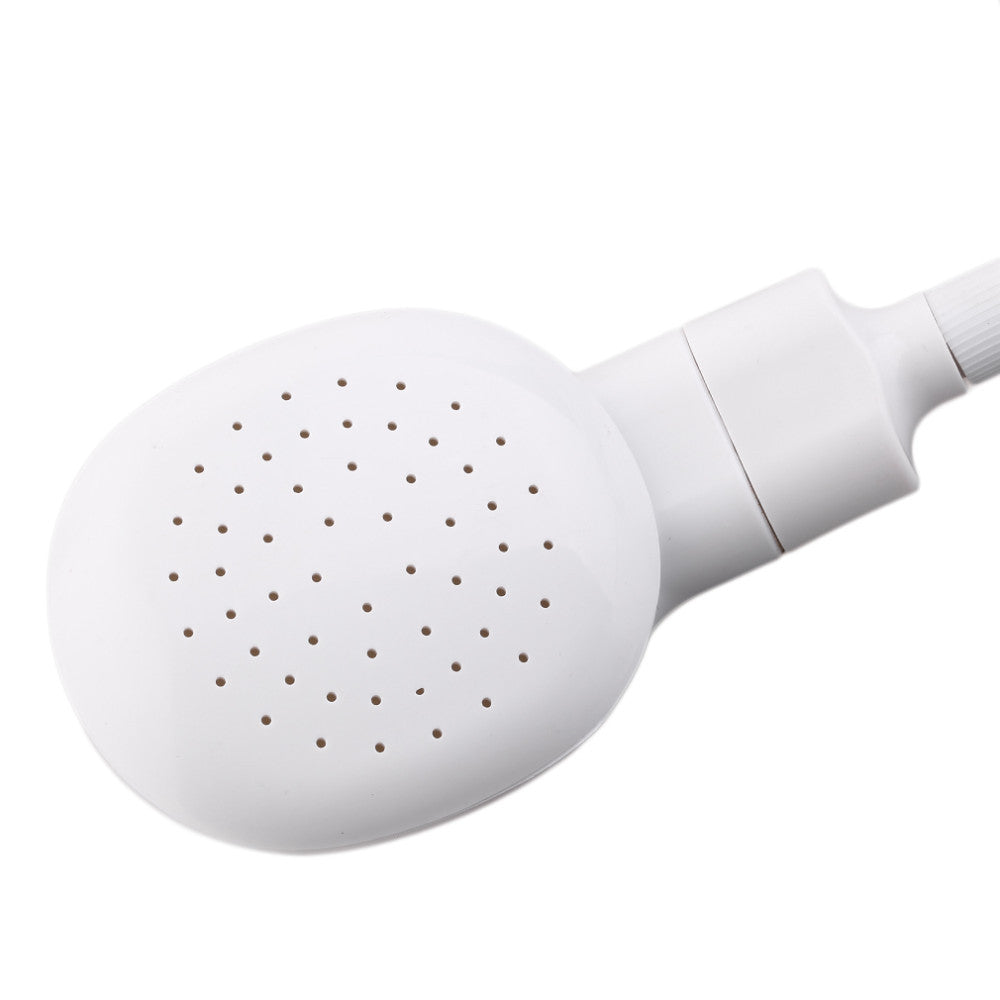 Close-up of white shower head water holes