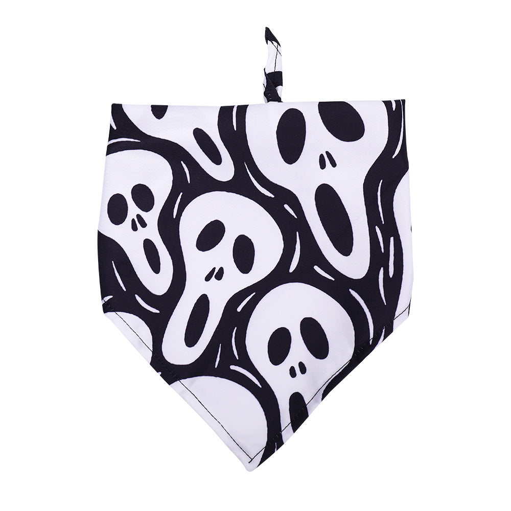 Close-up of white dog bandana decorated with overlapping screaming ghost faces