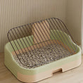 Cargar la imagen en la vista de la galería, Light green and peach dog potty tray showing removable metal grate resting on edge on wooden floor
