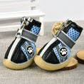 Load image into Gallery viewer, Pair of blue breathable dog boots featuring Velcro strap and paw print logo on the side
