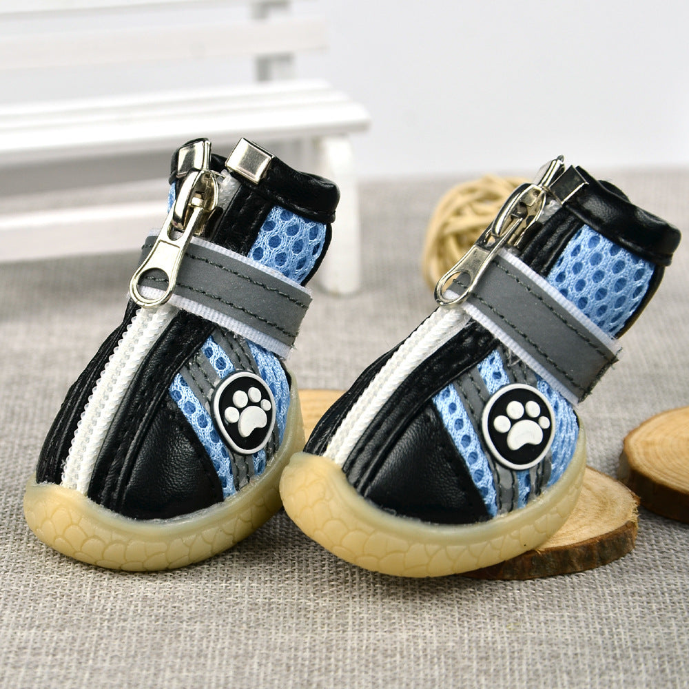 Pair of blue breathable dog boots featuring Velcro strap and paw print logo on the side
