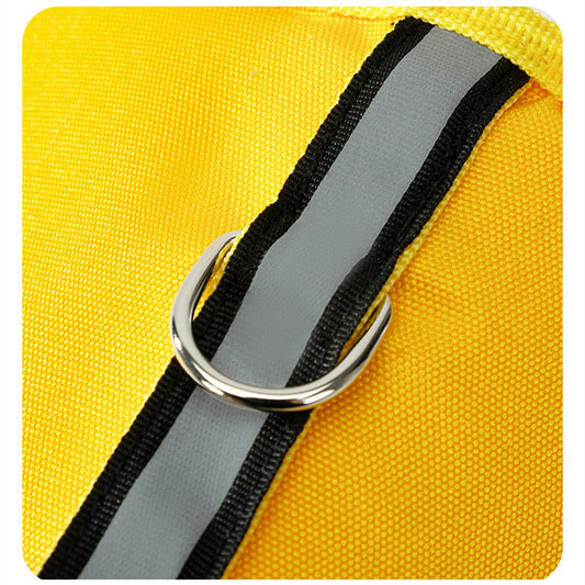 Close-up of metal D-ring and reflective strip on yellow Oxford cloth dog life jacket