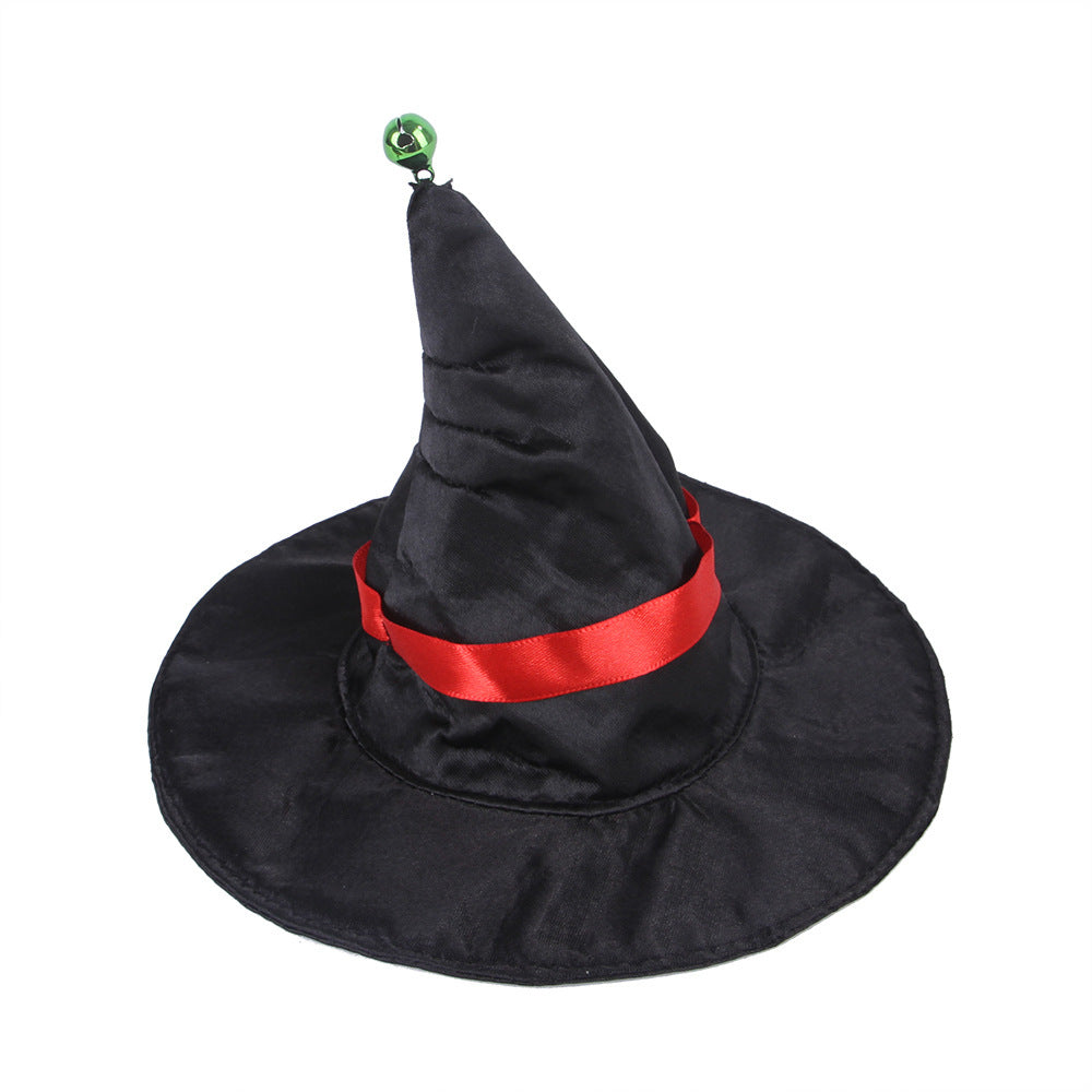 Black witch hat with red ribbon and green bell on top