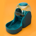 Load image into Gallery viewer, Blue automatic pet feeder fountain with transparent water reservoir on orange background
