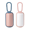 Load image into Gallery viewer, Close-up front view of blue-pink and white-pink pet poop bag dispensers with carabiner clips
