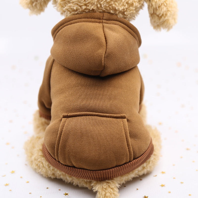 Small dog wearing a brown fleece hoodie with hood and back pocket sitting against a white background