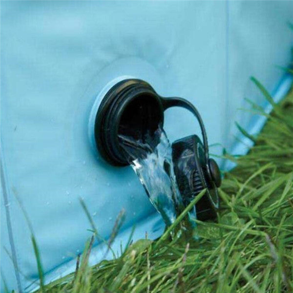 Water pouring out of dog pool drain valve onto grass
