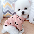Load image into Gallery viewer, Small white dog wearing pink ribbed turtleneck shirt with black polka dots and ruffled collar sitting on wooden floor
