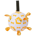 Cargar la imagen en la vista de la galería, White and yellow inflatable dog toy ball with dog and bone prints and multiple orange loops
