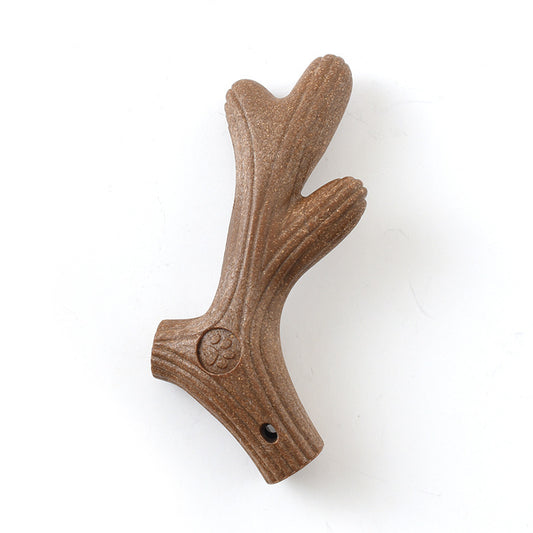 Close-up of brown stick-shaped dog chew toy with textured surface on white background