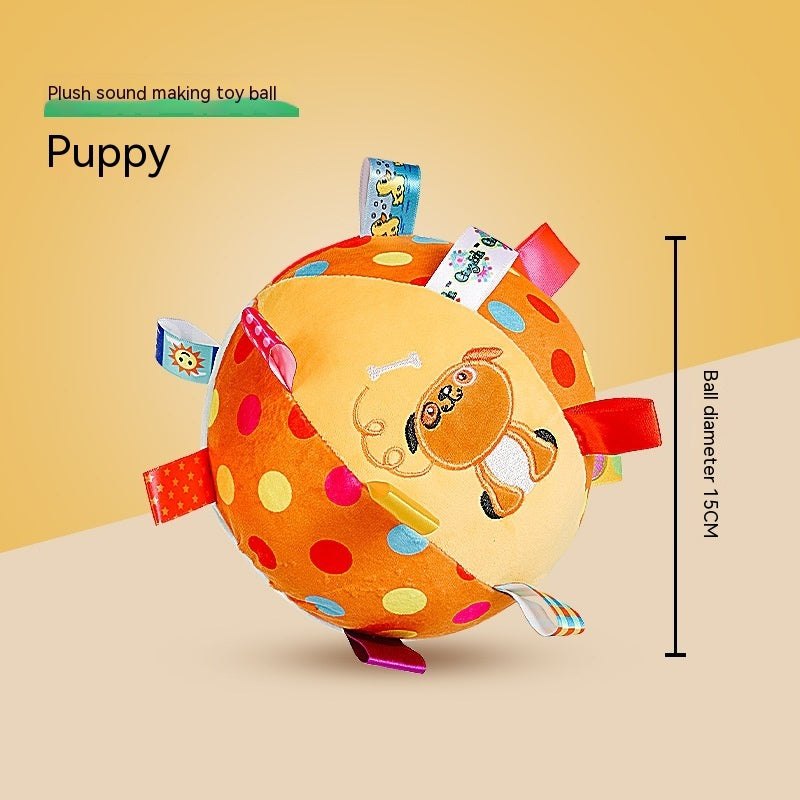 Orange plush dog toy ball with embroidered puppy face and large colored dots with multiple colorful ribbon loops
