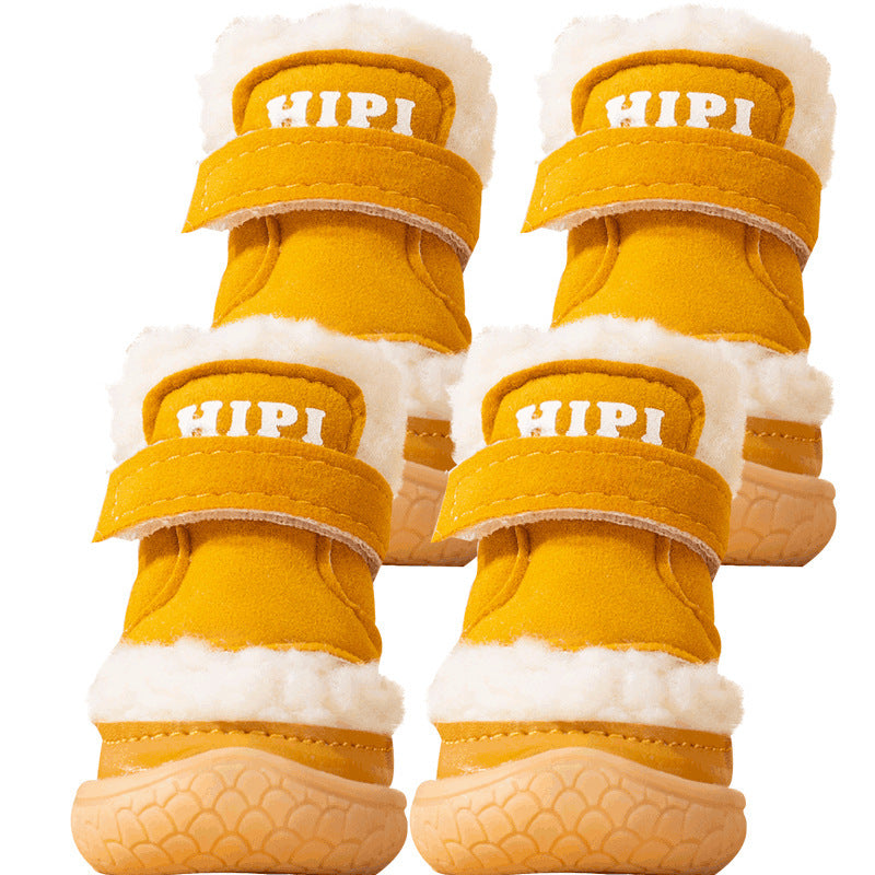 Four mustard yellow dog booties with fleece lining and adjustable straps shown from top view on white background