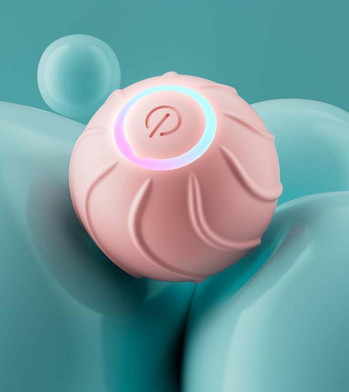 Close-up of pink silicone cat toy ball with LED ring light