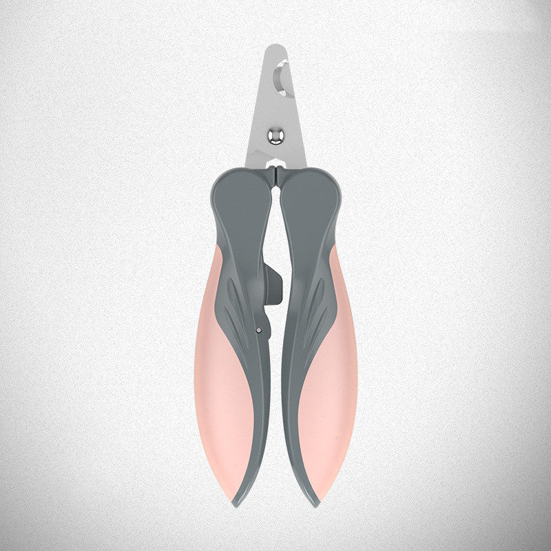 Close-up of pink and gray pet nail clipper showing blade and ergonomic handle on textured background