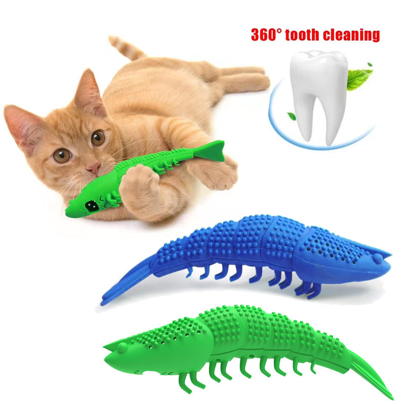 Orange cat playing with green lizard-shaped catnip chew toy highlighting 360-degree tooth cleaning feature