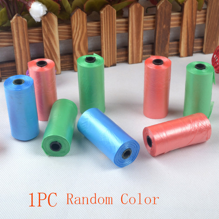 Assorted colored disposable dog waste bags in rolls of blue, green, and red
