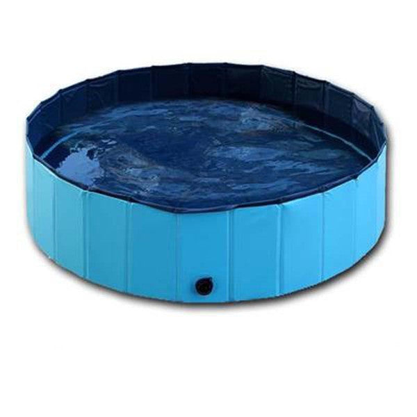 Blue round foldable dog pool filled with water on flat surface
